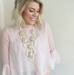 Blush ruffle blouse